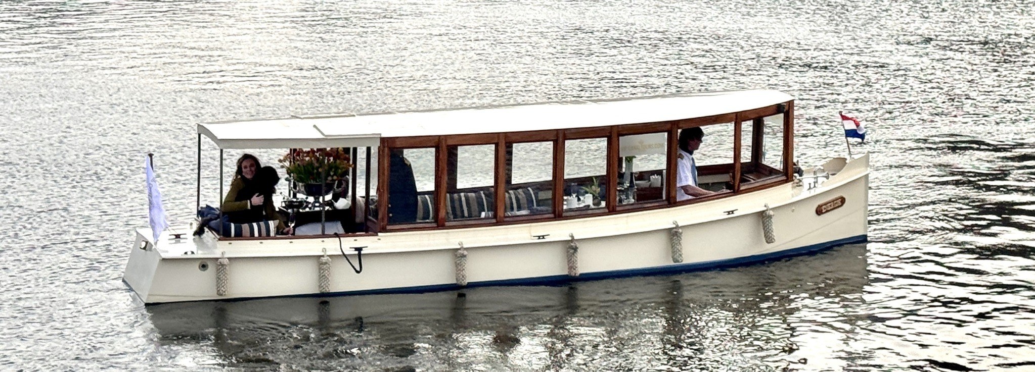 The real historic salon boat Energie cruising Amsterdam canals