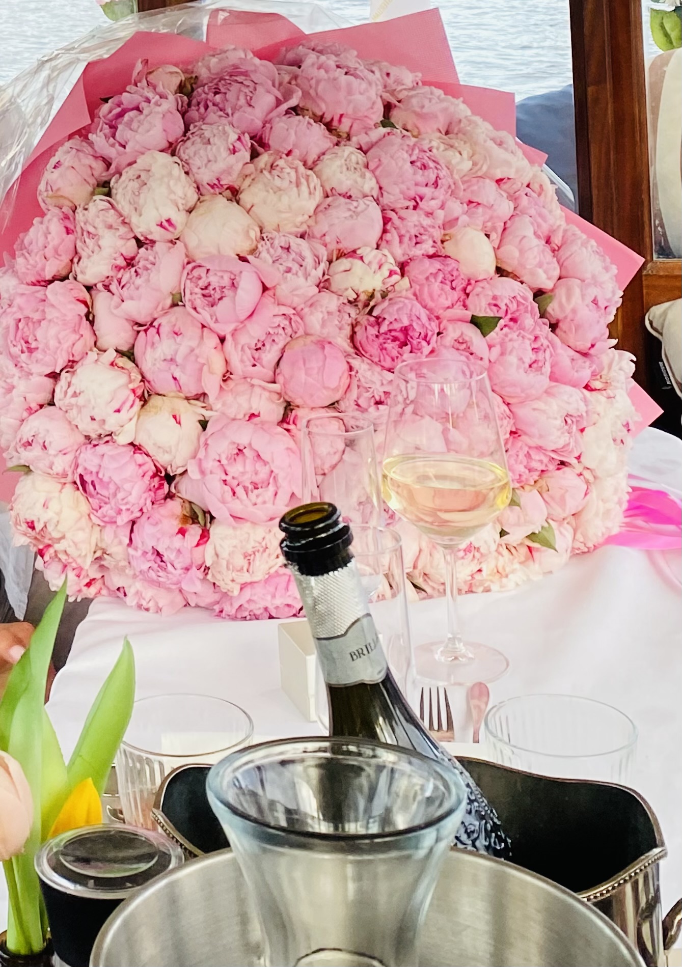 Flowers and champagne proposal styling aboard Energie